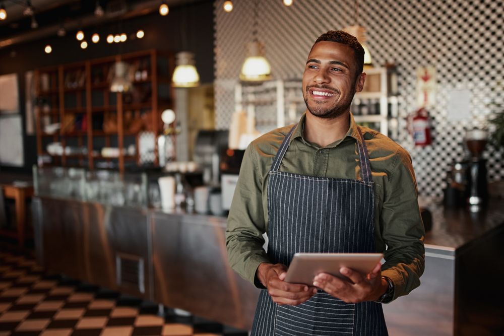 restaurant owner on laptop